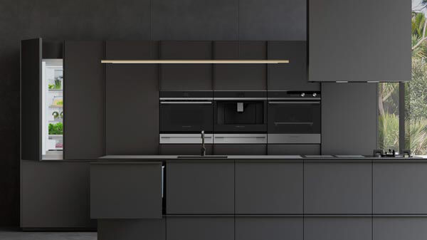 Black Cabinetry and Integrated Appliances in a Modern Kitchen.